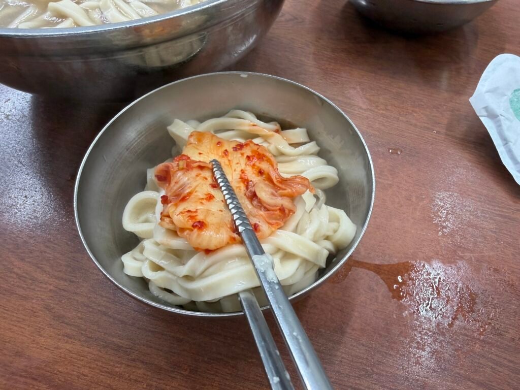 Bowl of kalguksu served on a rainy day at Hyeseong Kalguksu