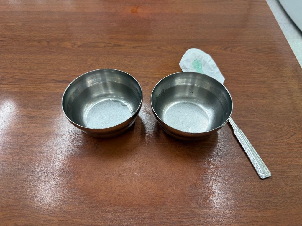 Small metal bowls given to diners before the meal at Hyeseong Kalguksu