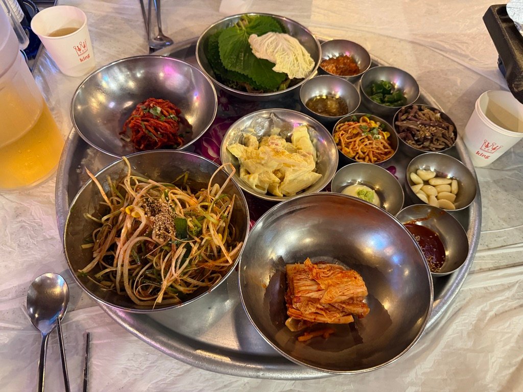 Assorted free banchan side dishes at a Korean BBQ restaurant