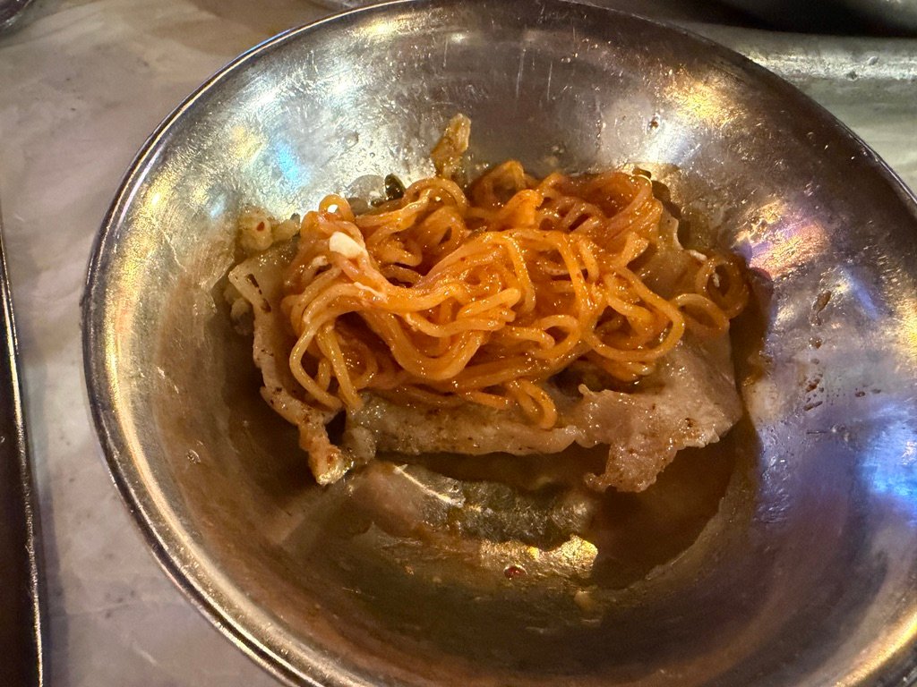 Spicy bibim noodles served as a side dish at a Korean BBQ restaurant