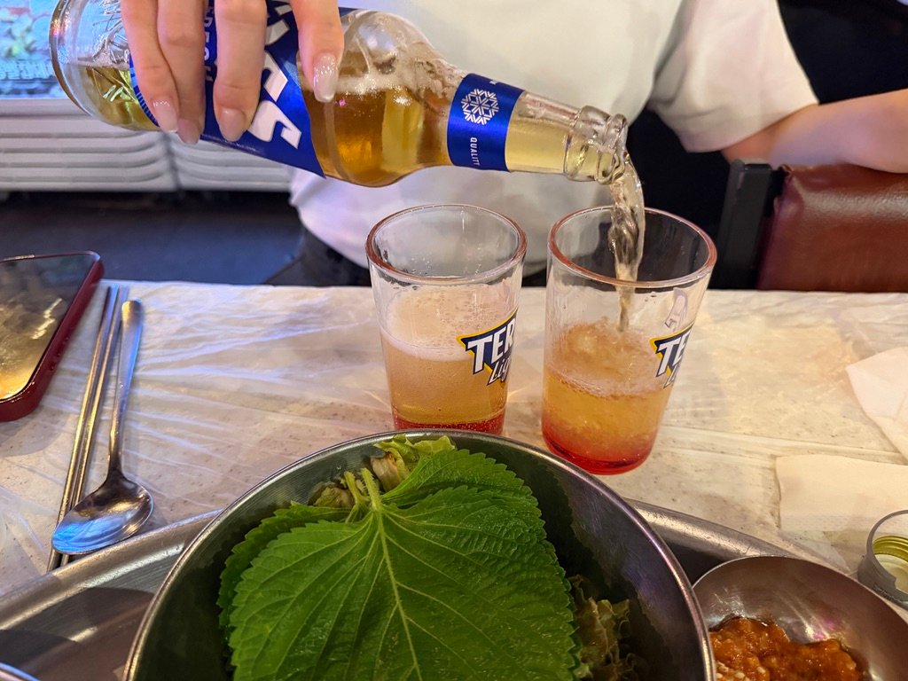 Soju and beer bottles for making somaek at a Korean restaurant