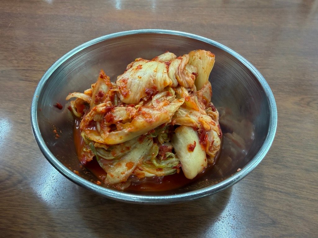Pepper and soy sauce condiments on the table at Hyeseong Kalguksu