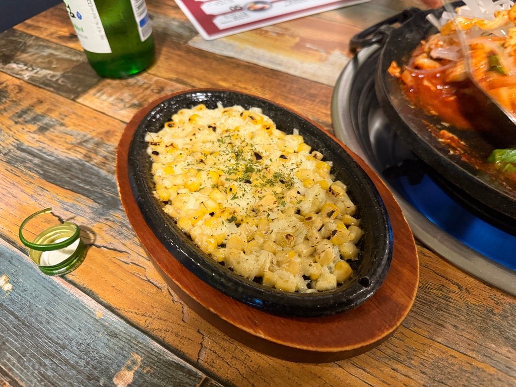 Corn and cheese side dish served to soften the spice