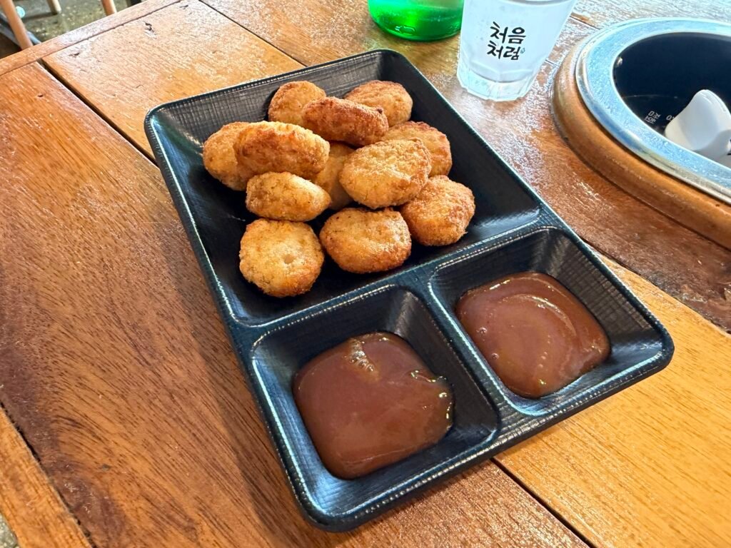 Mini pork cutlets served as a side dish at Boklaene Budae-jjigae