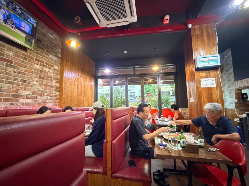 Interior of Hook Chicken with a TV playing a baseball game