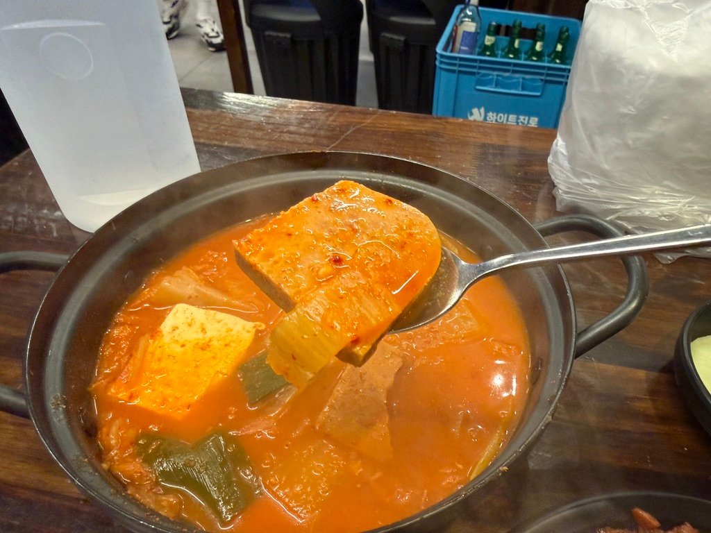 Close-up of Spam kimchi jjigae in a bowl