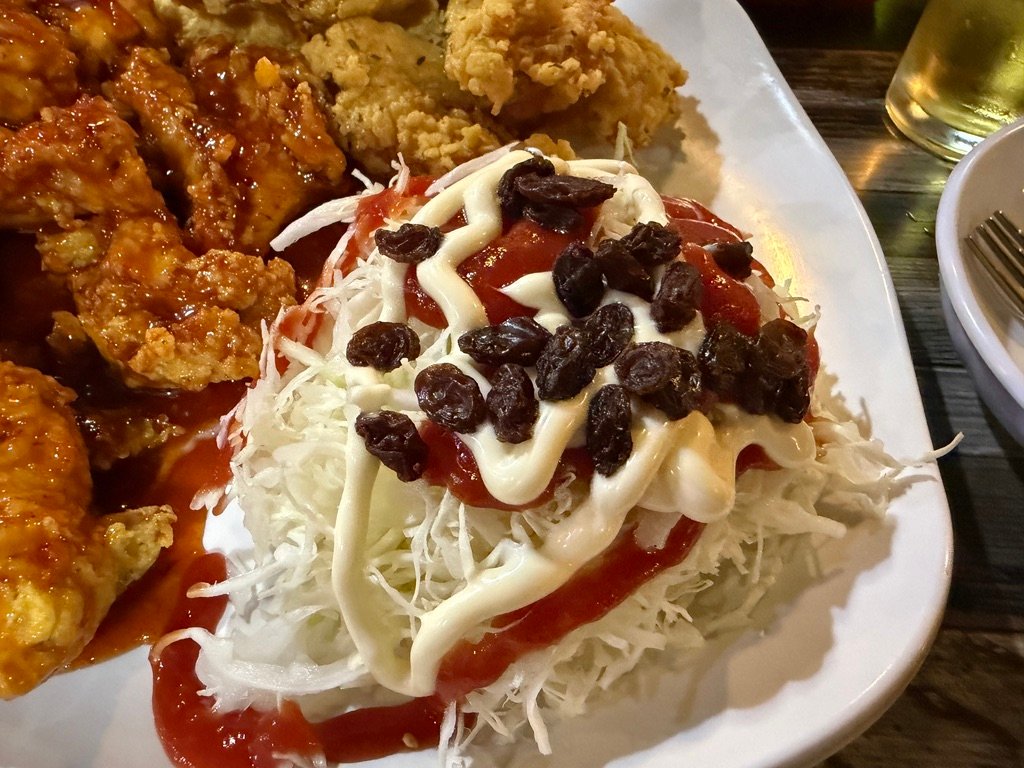 Side dish of pickled radish water kimchi served with chicken