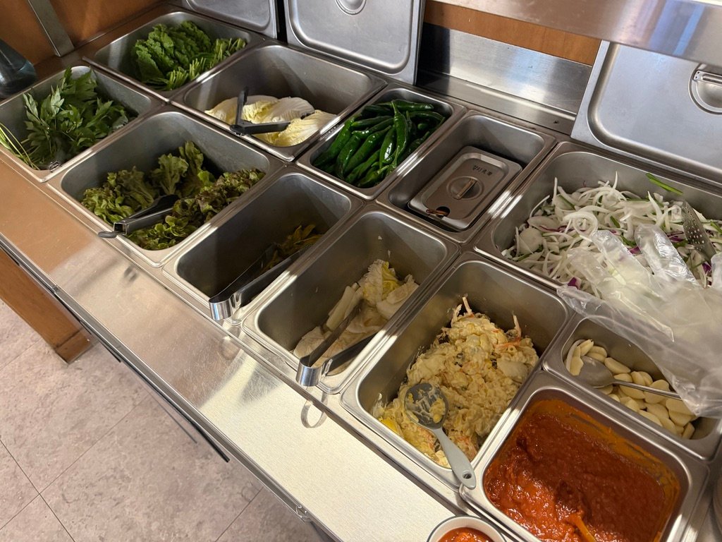 Self-serve vegetable and side dish bar at Hwaseongok samgyeopsal