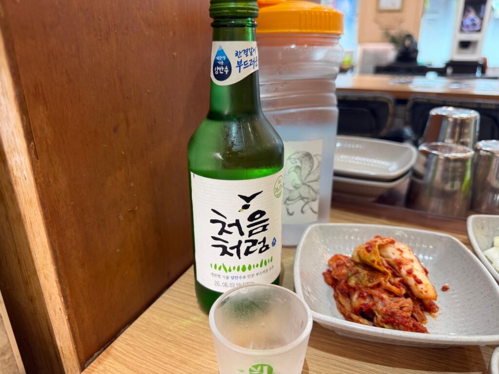 Bottle of Chum-Churum soju served alongside kimchi side dish