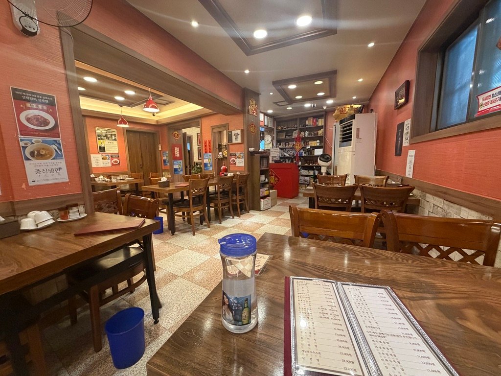 Traditional interior of Sillagwon Chinese restaurant with wooden tables and vintage decor